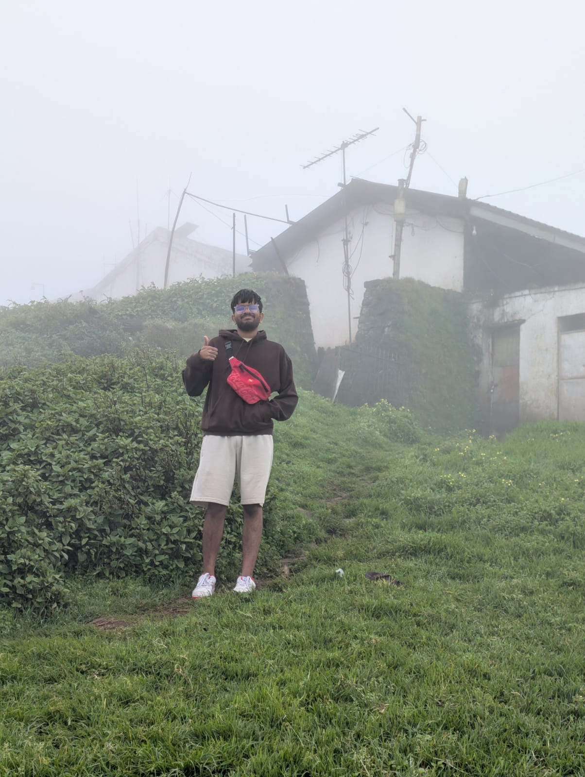 Aakash Reddy standing on a misty hillside